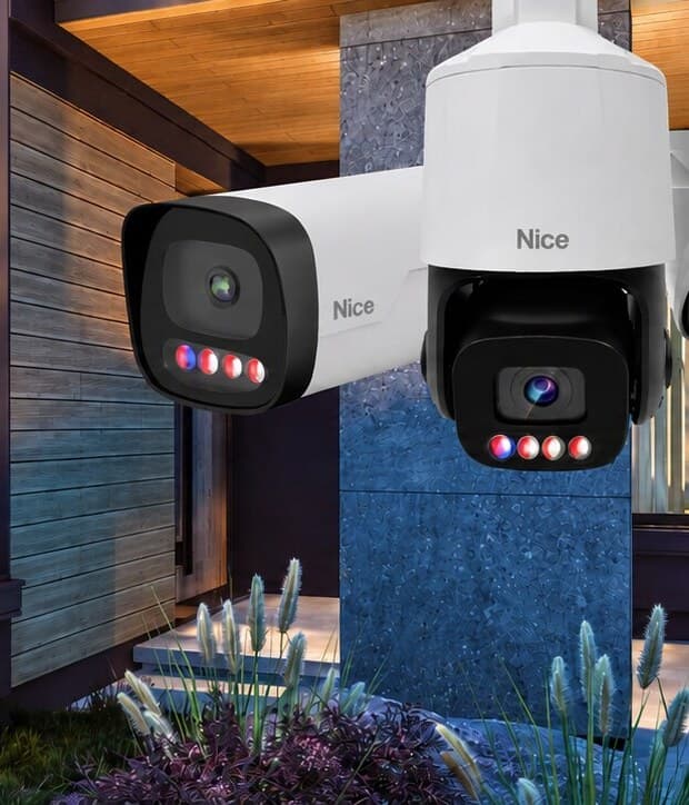 Nice bullet and pan-tilt-zoom security cameras on a modern home at dusk